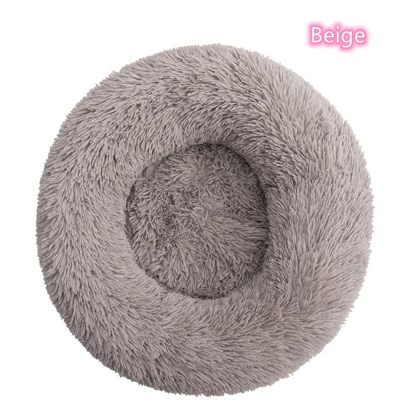Beige plush donut cat bed showing raised edges and soft interior